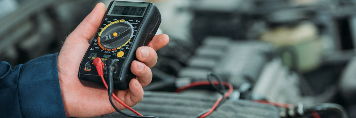 Auto Mechanic Using a Digital Multimeter